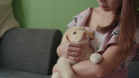 woman petting her puppy dog