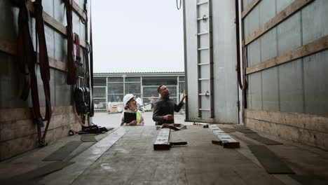 manager and truck driver checking truck