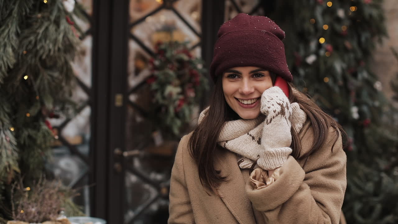 Woman talking on the phone during winter