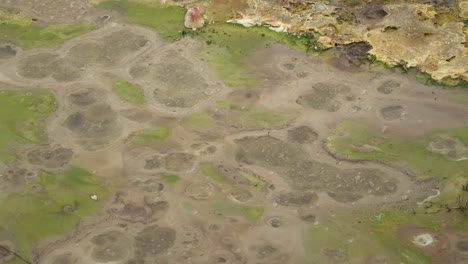 bubbles in a boiling hot geothermal volcanic mud pool at the geysers, "caldeiras of furnas", san miguel island, azores