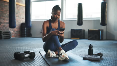 smile, fitness and black woman with a cellphone