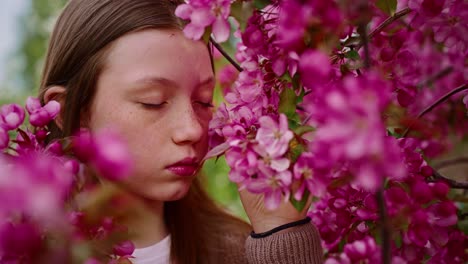 girl amongst pink blossoms