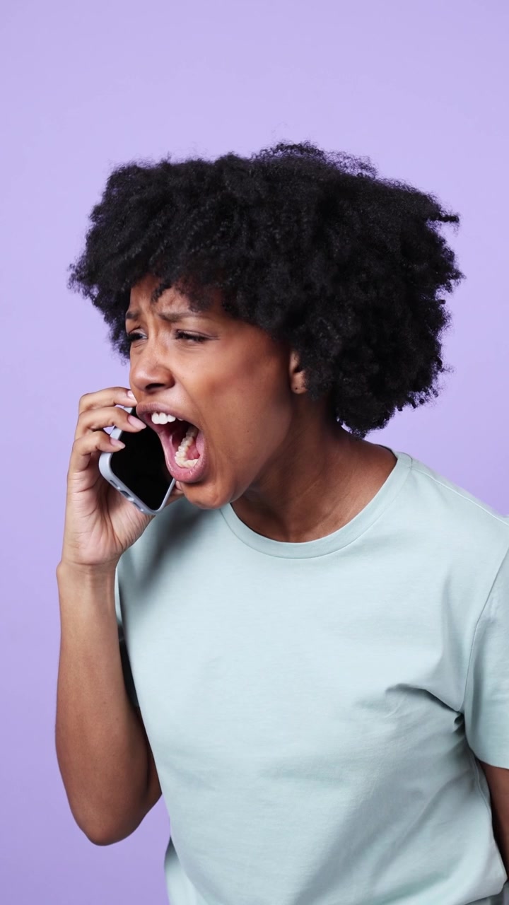 Young Black Woman Expresses Anger and Sadness During Phone Call
