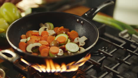 stir-frying vegetables in a wok