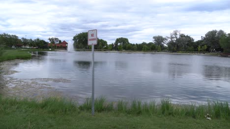 pond with no swimming sign medium shot