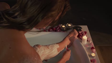 Caucasian-woman-shaving-leg-in-bath-in-hotel