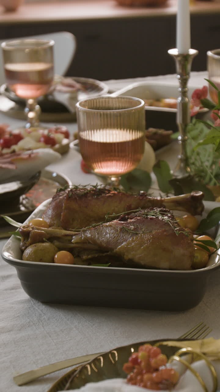 Thanksgiving Dinner Table Setting with Turkey, Wine, and Decorations