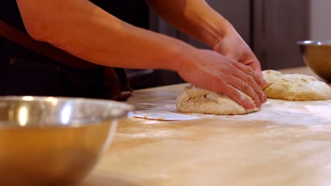 Chef-preparing-dough-on-the-table
