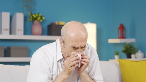 old man covering his mouth and nose while coughing.