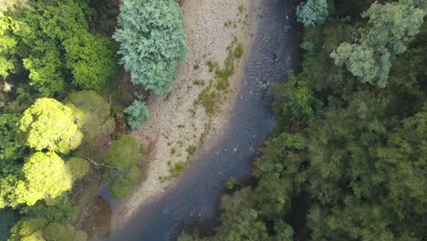 River-flowing-through-a-valley-in-mountain-foothills