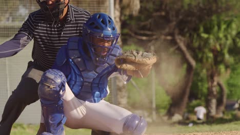 baseball player catching a ball during a match