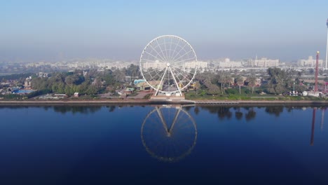 drone camera view of the iconic eye of the emirates wheel the most visible landmark at al montazah park in sharjah at al montazah park, united arab emirates, 4k video