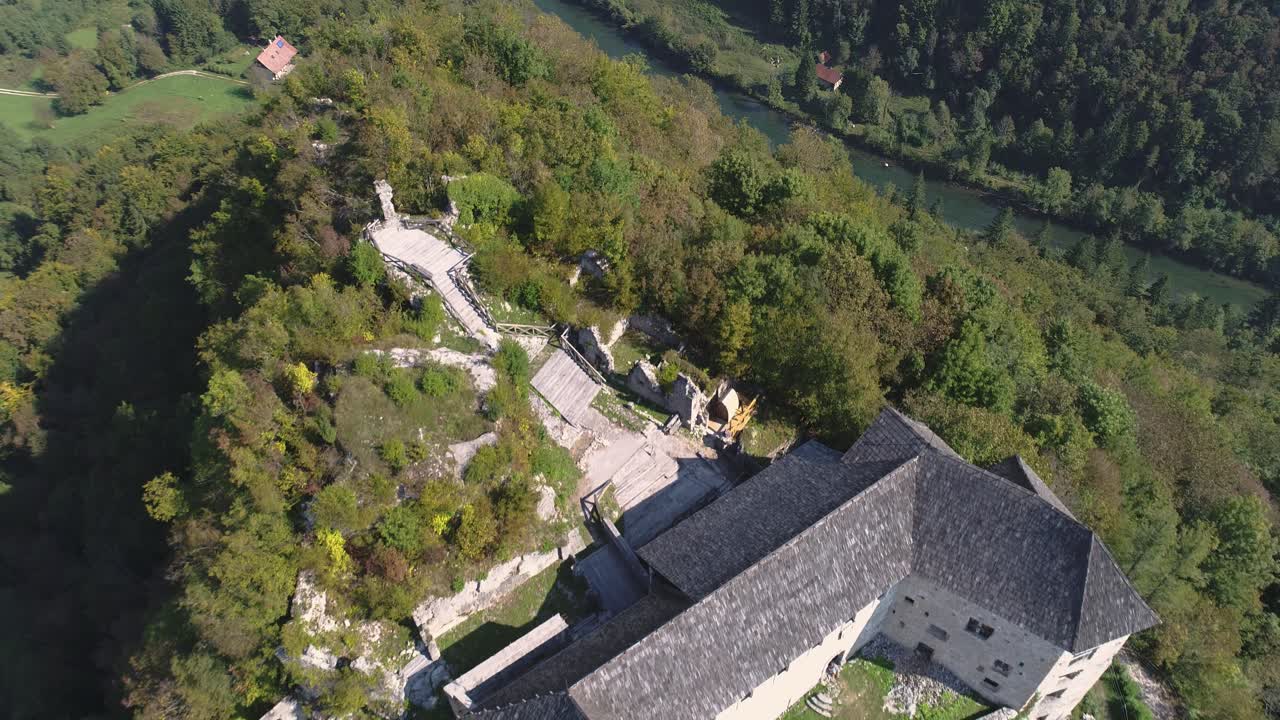 Aerial Drone Shot of Kostel Castle Overlooking Kolpa River. Slovenia, Eastern Europe