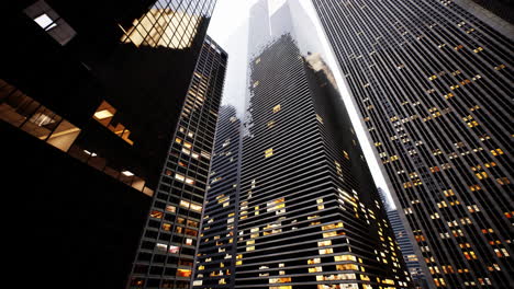 a view of tall skyscrapers in a city at night