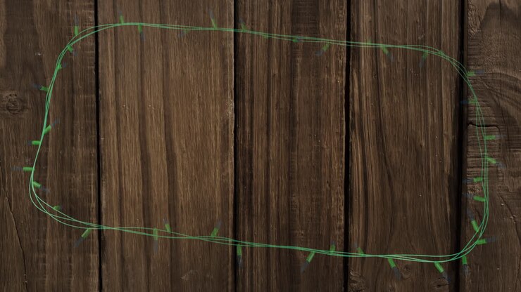 Animation of flickering fairy lights with copy space on wooden background
