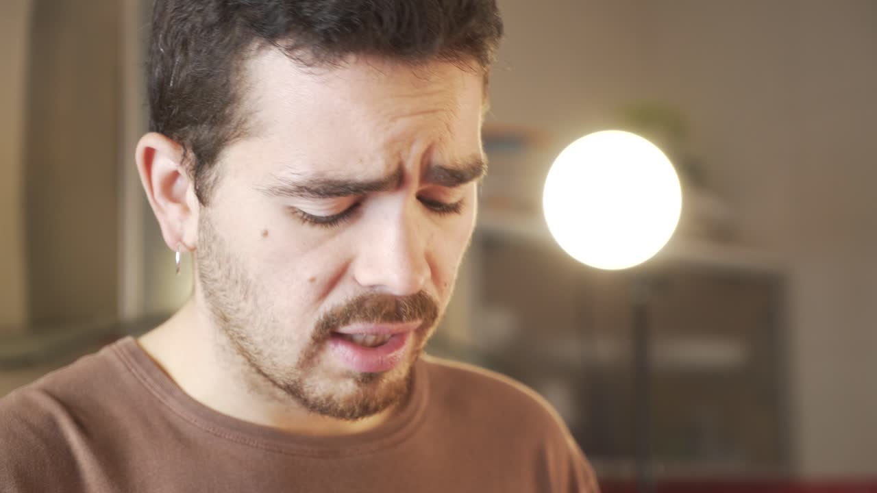 Millennial recording a video of himself in a cuisine talking to his audience