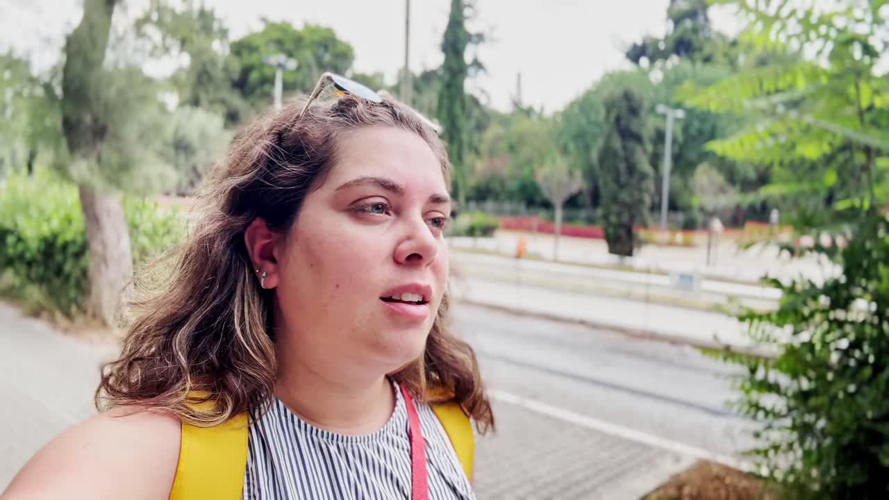 Thoughtful Young Woman Looking Away with Curious Expression Outdoors