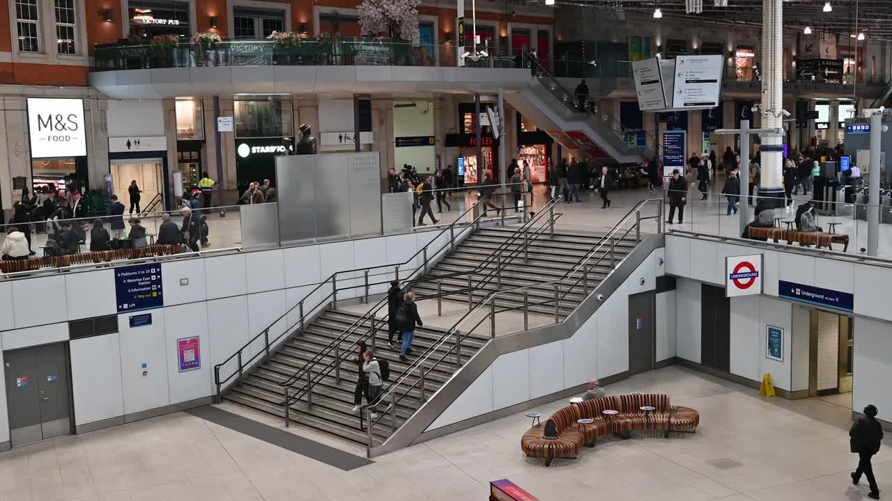Passengers walking through Waterloo Station, London, United Kingdom