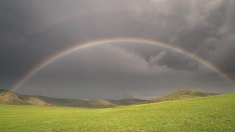 colorful rainbow in vast treeless meadow