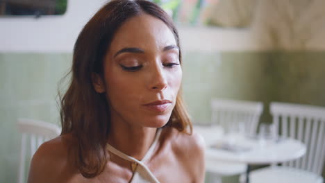 tanned lady eating lunch cafeteria closeup. luxurious woman chewing tasty meal
