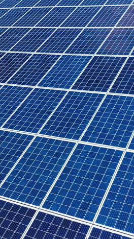 aerial view. top view on blue solar pannels. green energy. pannels on the roof. vertical video