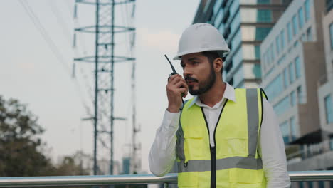 construction worker using walkie-talkie