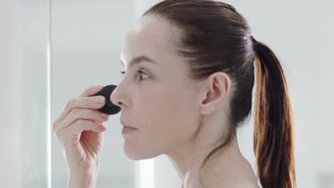 Portrait-of-a-mature-woman-with-ponytail-after-spa-massage-and-anti-aging-treatment-on-face