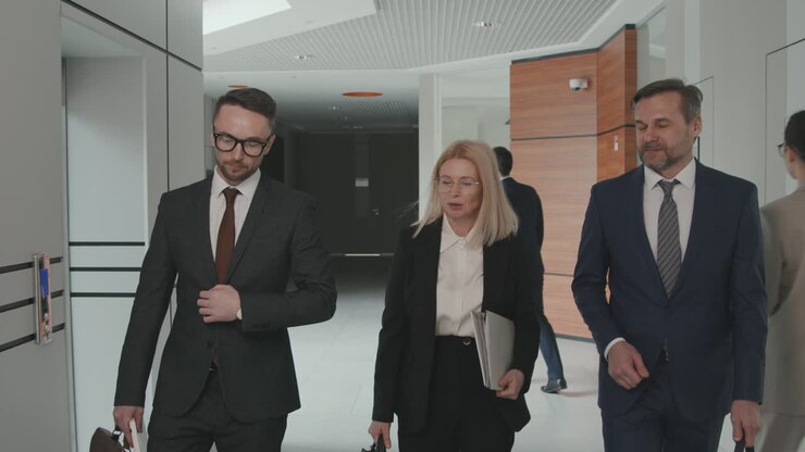 Team of Lawyers Walking through Office