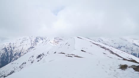 Panoramic-view-of-snow-covered-ridge-and-mountain-terrain-of-Romania