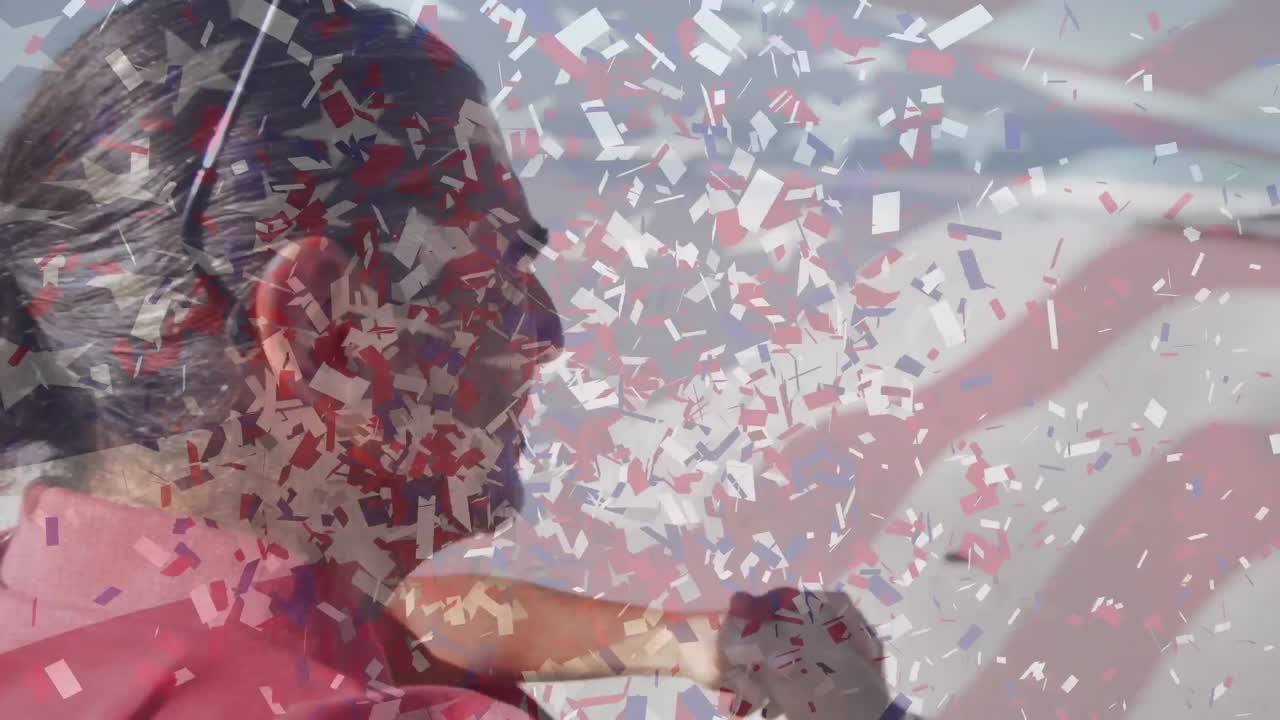 미국 국기의 애니메이션과 해변에 있는 노인 위의 콘페티