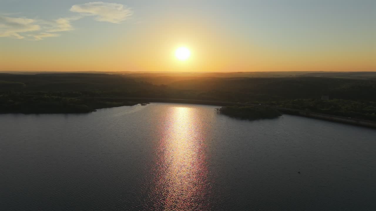 Urugua-í hydroelectric dam and reservoir generating clean energy under golden sunset, Misiones, Argentina