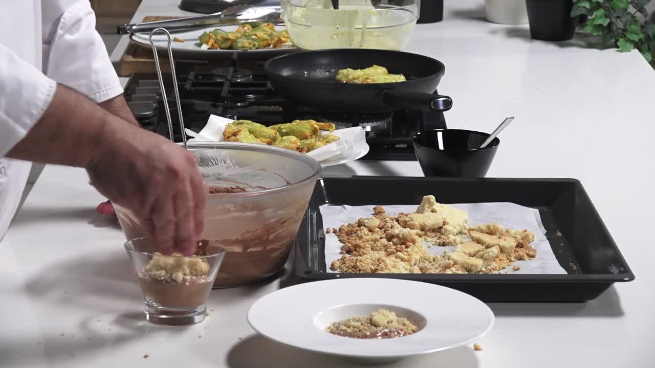 A chef prepares a delicious dessert in a home kitchen. Ingredients are mixed, and sweet treats are being shaped and cooked. The atmosphere is warm and inviting as aromas fill the air