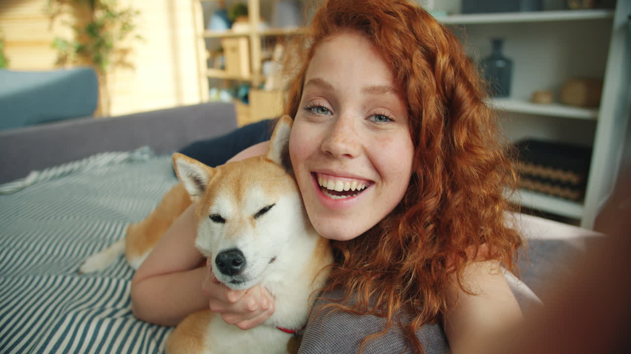 Woman and her Dog having a cozy moment at home