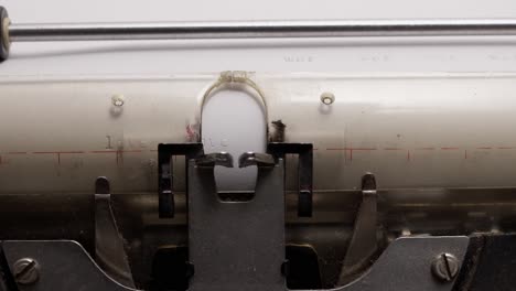detailed close-up of vintage typewriter typing the word "love" on paper