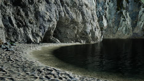 view of a high cliff and black ocean