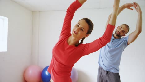 Man-and-woman-doing-stretching-exercise-4k