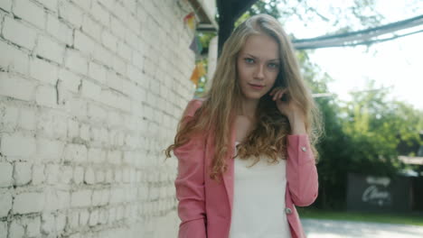 young woman in a pink blazer