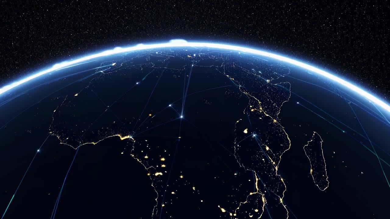 Aerial video view of Earth at night, showcasing illuminated cities and network lines