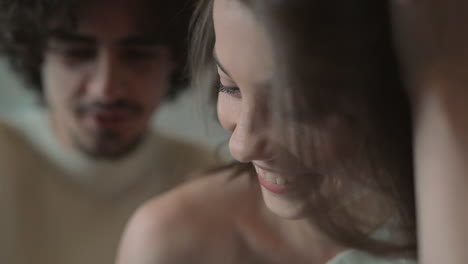 close up portrait of young cute couple looking something funny