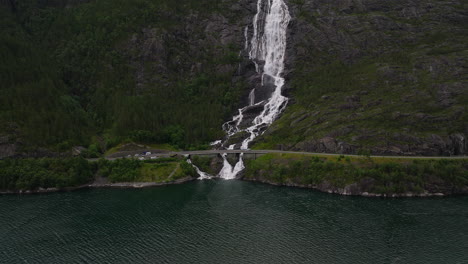 impressive langfoss waterfall cascades down cliffside toward akrafjord, norway