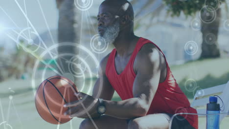 animation of network of connections over senior african american man with basketball at beach