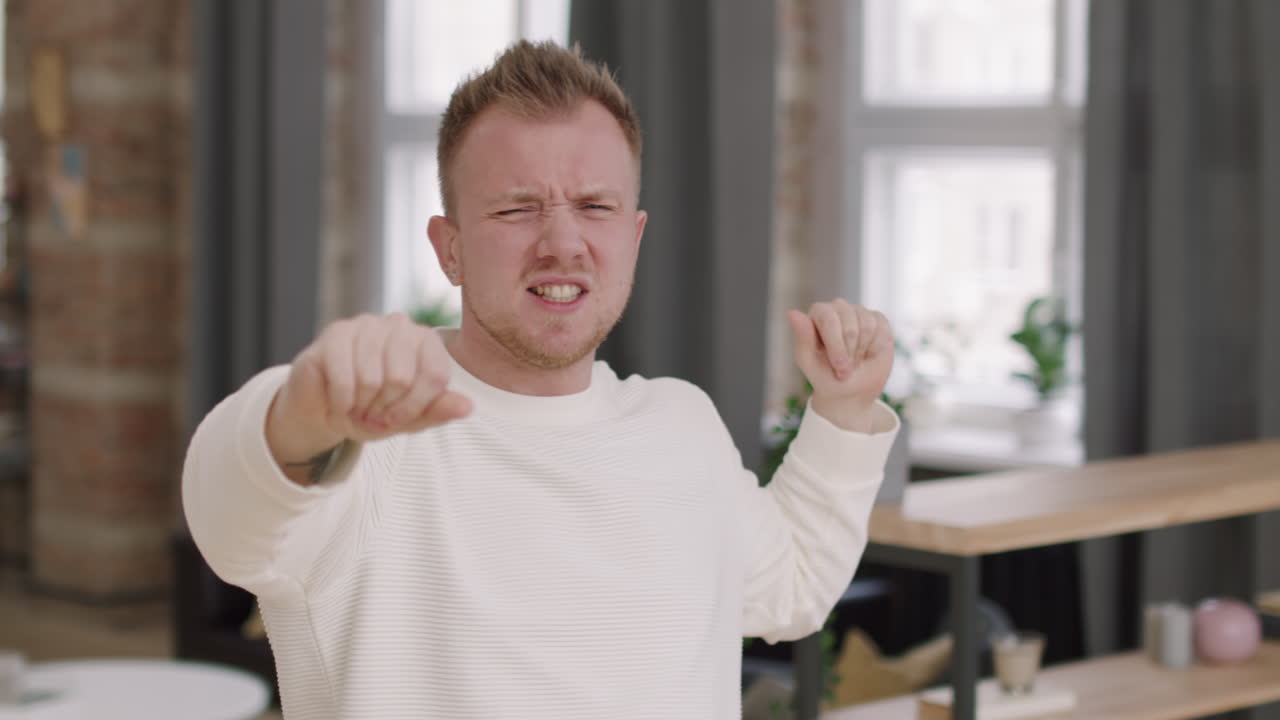 Happy Man Dancing to Music at Home