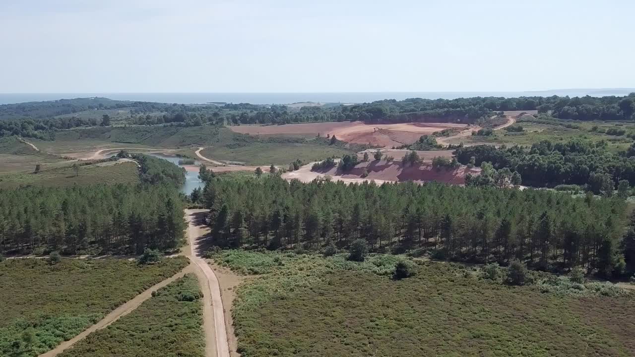 Aerial view of a natural landscape with a quarry