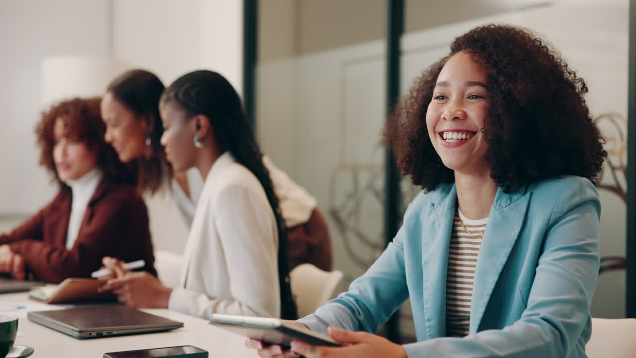 Businesswomen Shaking Hands in a Meeting