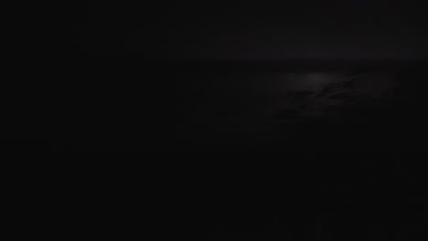 heat lightning on gloomy night in everglades sawgrass and water landscape