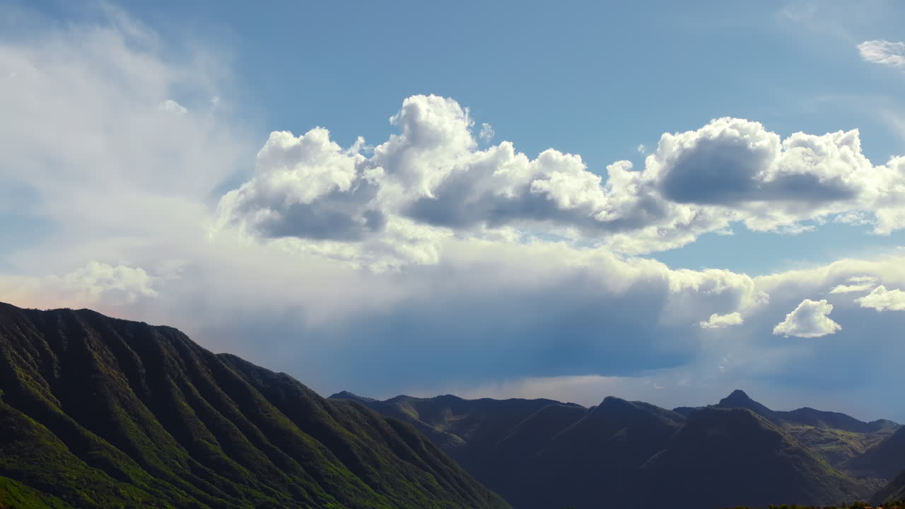 Aerial drone view of the Alps with a blue sky near Lake Como, Italy