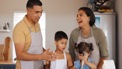 Family-home,-laughing-and-kitchen-cooking