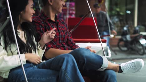 Handheld-view-of-couple-traveling-by-Vietnamese-mode-of-transport