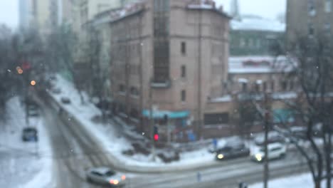 snowy city view from a window