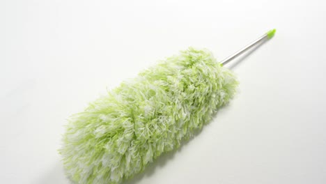 close-up of green cleaning duster